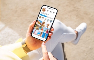 person checking Instagram on their phone person checking Instagram on their phone